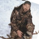 Author Dan Pine with a buck in snow